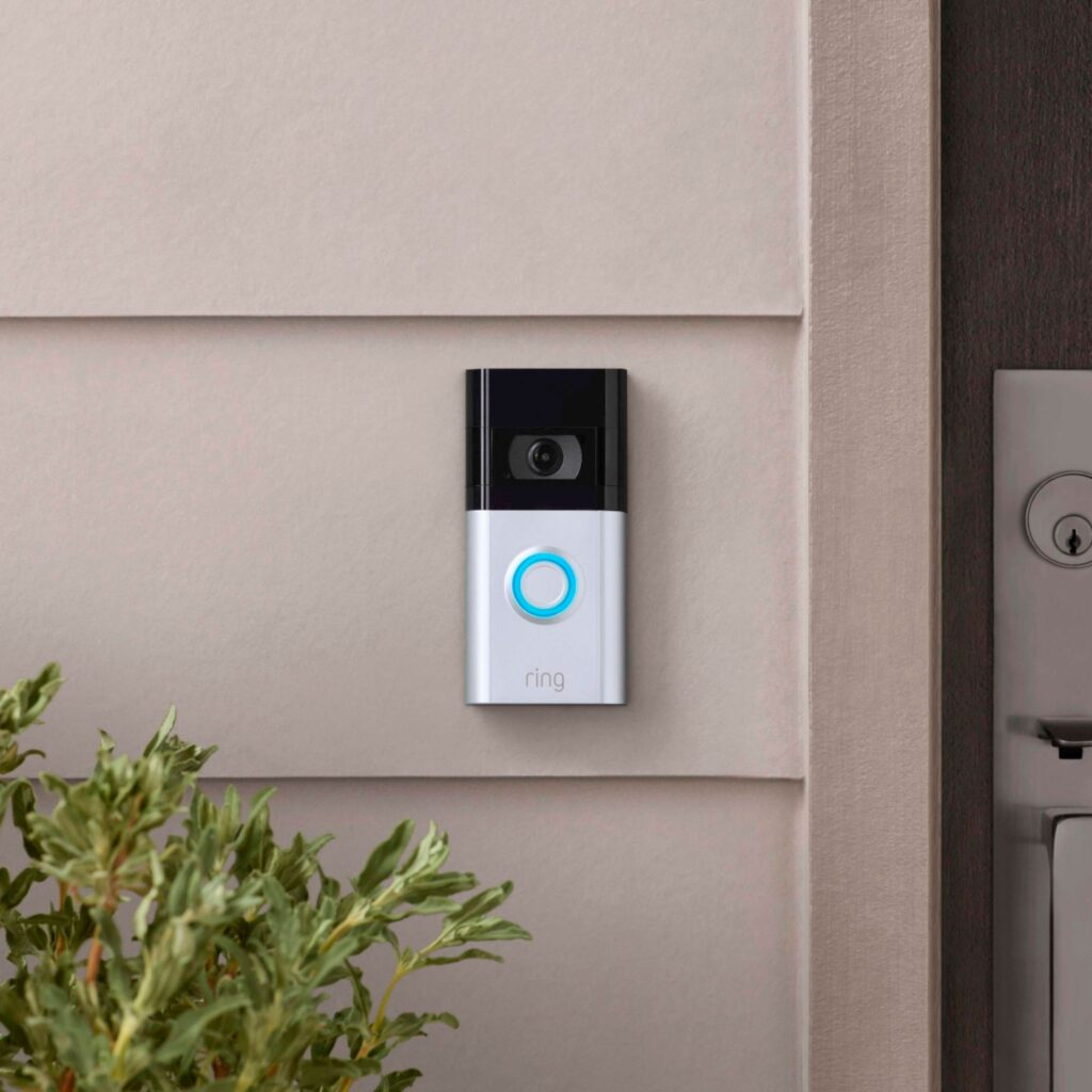 Ring video doorbell professionally installed beside a front door
